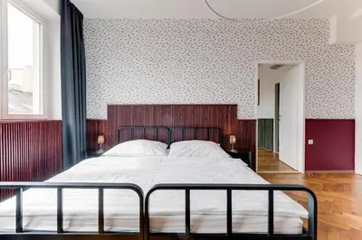 a bedroom with a large bed in a room at Apartment Petrska in Prague