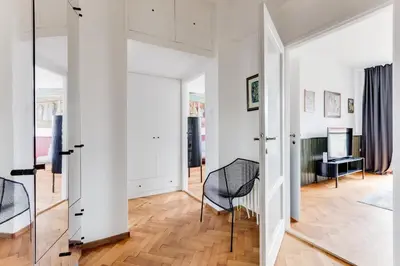 a room with white walls and a glass door at Apartment Petrska in Prague