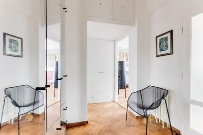 two chairs in a room with white walls at Apartment Petrska in Prague