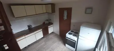 a small kitchen with a stove and a refrigerator at Chata u rybníka in Mšecké Žehrovice