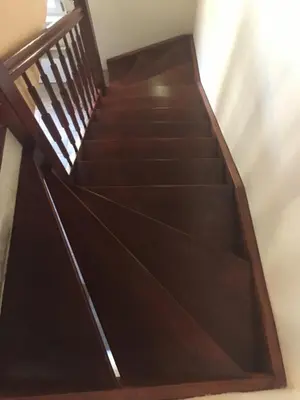 a stair case with wooden steps in a building at Chata u rybníka in Mšecké Žehrovice