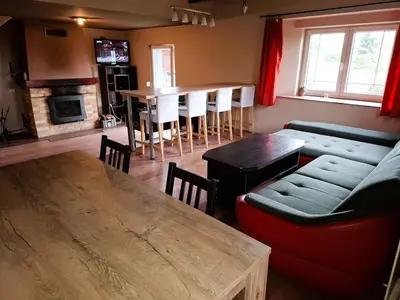 a living room with a couch and a table at Chata u rybníka in Mšecké Žehrovice