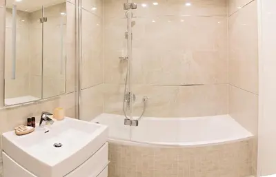a bathroom with a shower and a sink and a tub at Rezidence Muzeum in Prague