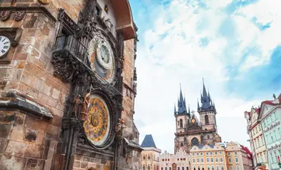 a building with a clock on the side of it at Pawlansky Prague Apartments in Prague