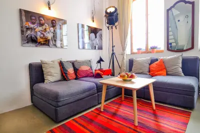 a living room with a couch and a table at Pawlansky Prague Apartments in Prague