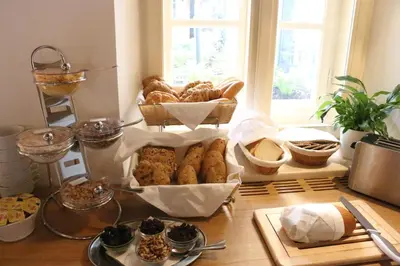 a tray of food in a kitchen with eggs and vegetables at Hotel At the White Lily in Prague