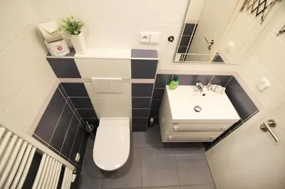 a small bathroom with a toilet and a sink at Beautiful Apartment Dlouhá in Prague