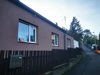 a house with a fence and a window at Apartments Zbraslav in Prague