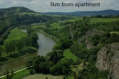 an aerial view of a river in a valley at Apartments Zbraslav in Prague