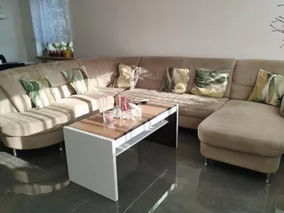 a living room with a couch and a coffee table at Ubytování Irena in Benešov