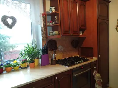a kitchen with a stove and a window at Ubytování Irena in Benešov