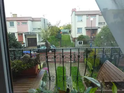 a bird sitting on a fence outside a window at Ubytování Irena in Benešov