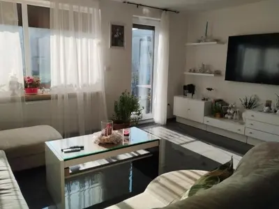 a living room with a couch and a table at Ubytování Irena in Benešov