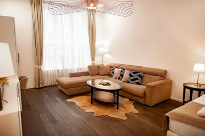 a living room with a couch and a table at Luxury Modern Designed Oldtown Apartment in Prague