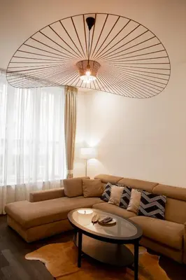 a living room with a couch and a table at Luxury Modern Designed Oldtown Apartment in Prague