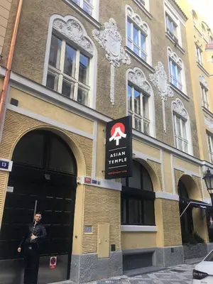 a man standing in the doorway of a building at Luxury Modern Designed Oldtown Apartment in Prague