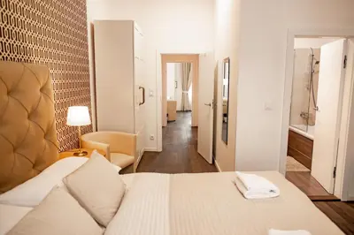 a hotel room with a bed and a bathroom at Luxury Modern Designed Oldtown Apartment in Prague