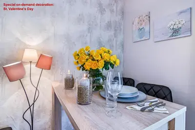 a living room with a bed and a kitchen at AIR CONDITIONED Terrace Apartment Prague in Prague