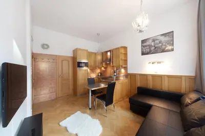 a living room with a couch and a table at Old Town Melantrichova Apartment in Prague