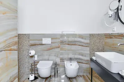 a bathroom with a sink and a toilet at Hotel Garden Court in Prague