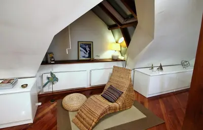 a living room with a chair and a table at Residence Salvator - by Prague City Apartments in Prague