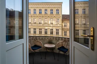 a dining room with a wooden table and chairs at Old Town - Aparthotel Michalska in Prague