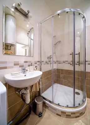 a bathroom with a shower and a sink at A/C + TERRACE Breakfast at Tiffany’s in Prague