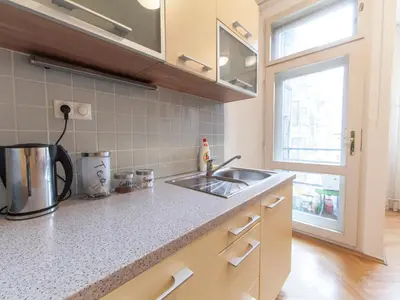 a kitchen counter with a sink and a window at Modern Central Apartment Dlouhá in Prague