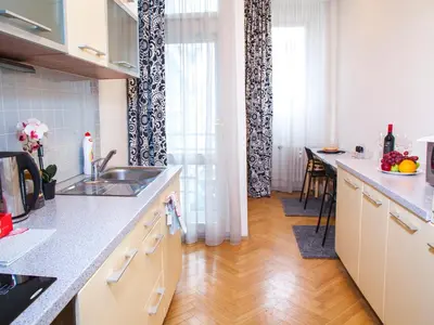 a kitchen with a sink and a counter top at Modern Central Apartment Dlouhá in Prague