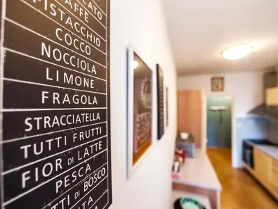 a chalkboard sign on a wall in a room at Modern Central Apartment Dlouhá in Prague