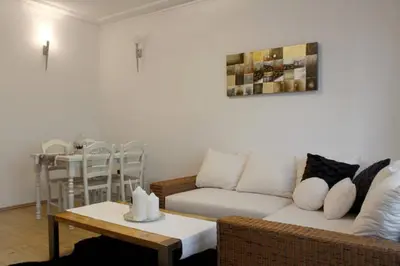 a living room with a couch and a table at Apartment Argentinská 8 in Prague