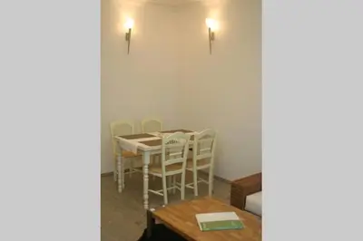 a dining room with a table and chairs in a room at Apartment Argentinská 8 in Prague