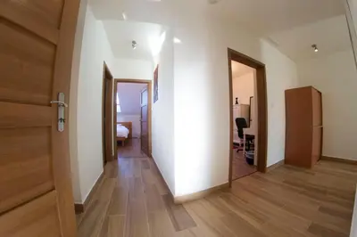 a hallway with a door leading to a bedroom at Prague Gate Apartments in Prague
