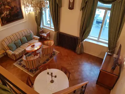 an overhead view of a living room with a table and chairs at Charles apartment in Prague