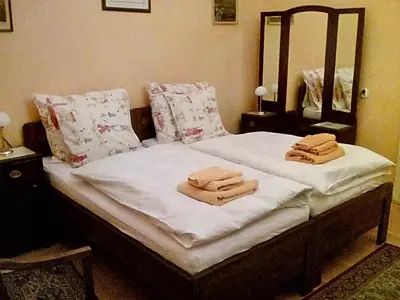 a bed with two towels on top of it at Miraculous Appartement in Prague
