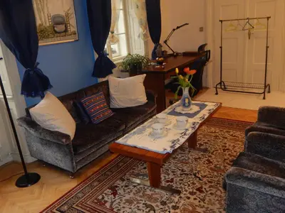 a living room with a couch and a coffee table at Miraculous Appartement in Prague