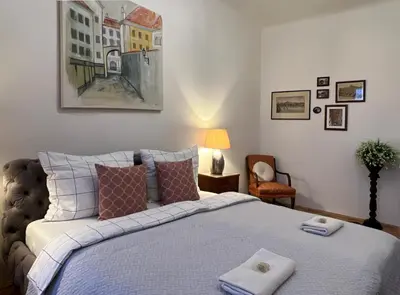 a bedroom with a bed with towels on it at Residence Charles Bridge in Prague