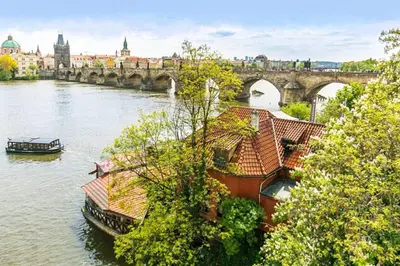 a bedroom with a bed with two towels on it at Residence Charles Bridge in Prague