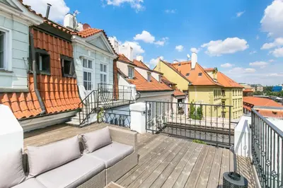 a living room with a bed and a couch at Residence Charles Bridge in Prague