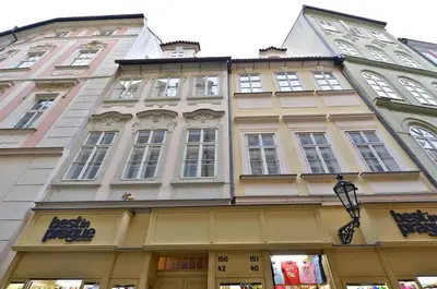 a tall building with a store in front of it at Eclectic Loft with Terrace in Prague