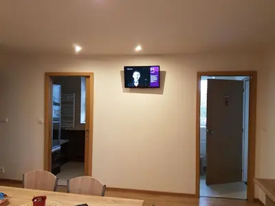 a television on the wall of a living room at Apartments Anna and Ondra in Prague