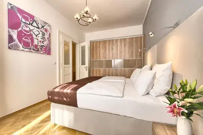 a bedroom with a large bed in a room at Maiselova 5 Apartment in Prague