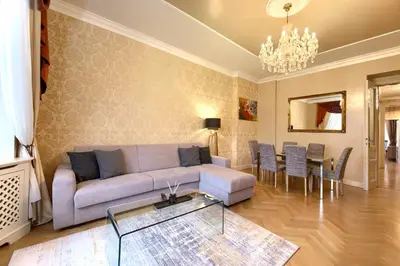 a living room with a couch and a table at Milosrdnych Apartments in Prague