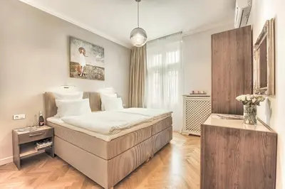 a bedroom with a large bed in a room at Milosrdnych Apartments in Prague