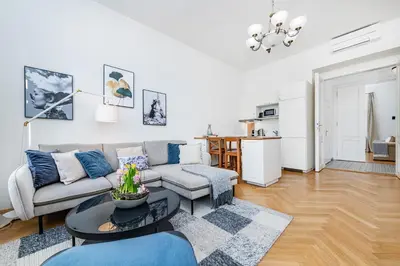 a living room with a couch and a table at Quiet Apartment in The Old Town in Prague
