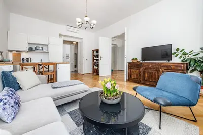 a living room with a couch and a table at Quiet Apartment in The Old Town in Prague
