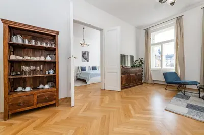 a large white room with a room with a bedroom at Quiet Apartment in The Old Town in Prague