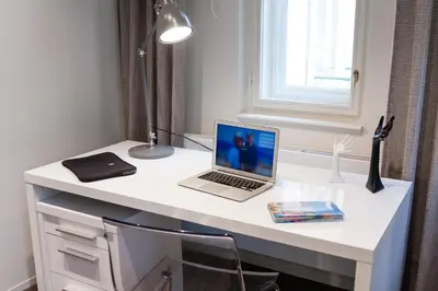 a white desk with a laptop computer on it at Residence Glamour Premium in Prague