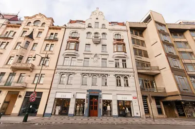 a large white building on a city street at Residence Glamour Premium in Prague