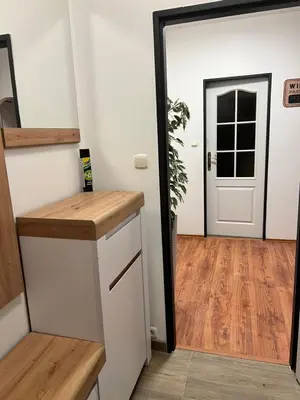 a hallway with a door leading into a room at Penzion Mánes in Krabčice